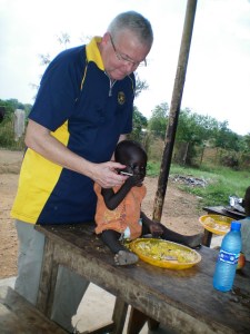 Former Rotary Club of Juba President Michael Elmquist with the children